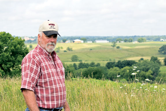 Mcbee standing in one of his fields