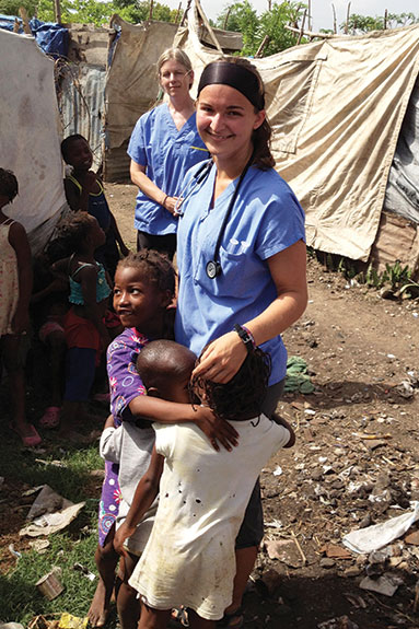 Amanda Emery soaking up time with kids in Merger, Haiti.